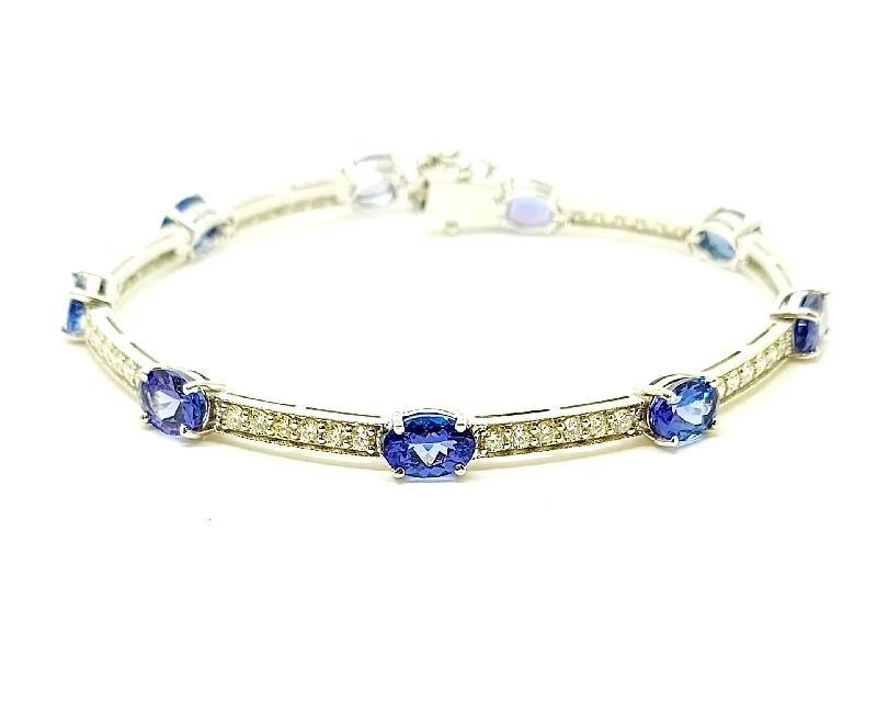 ladies-rustic-pearl-bracelets-TANZANITE AND DIAMOND STATION BRACELET IN 14K WHITE GOLD AD NO # 2709