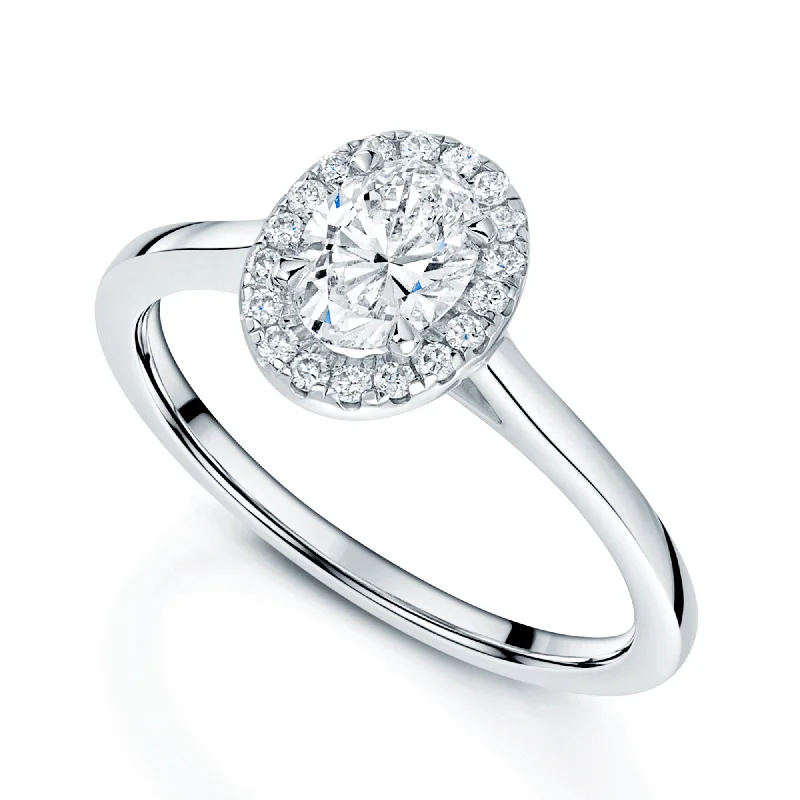 Ladies engagement rings with sly accents -Platinum Oval Diamond Halo Surround Engagement Ring